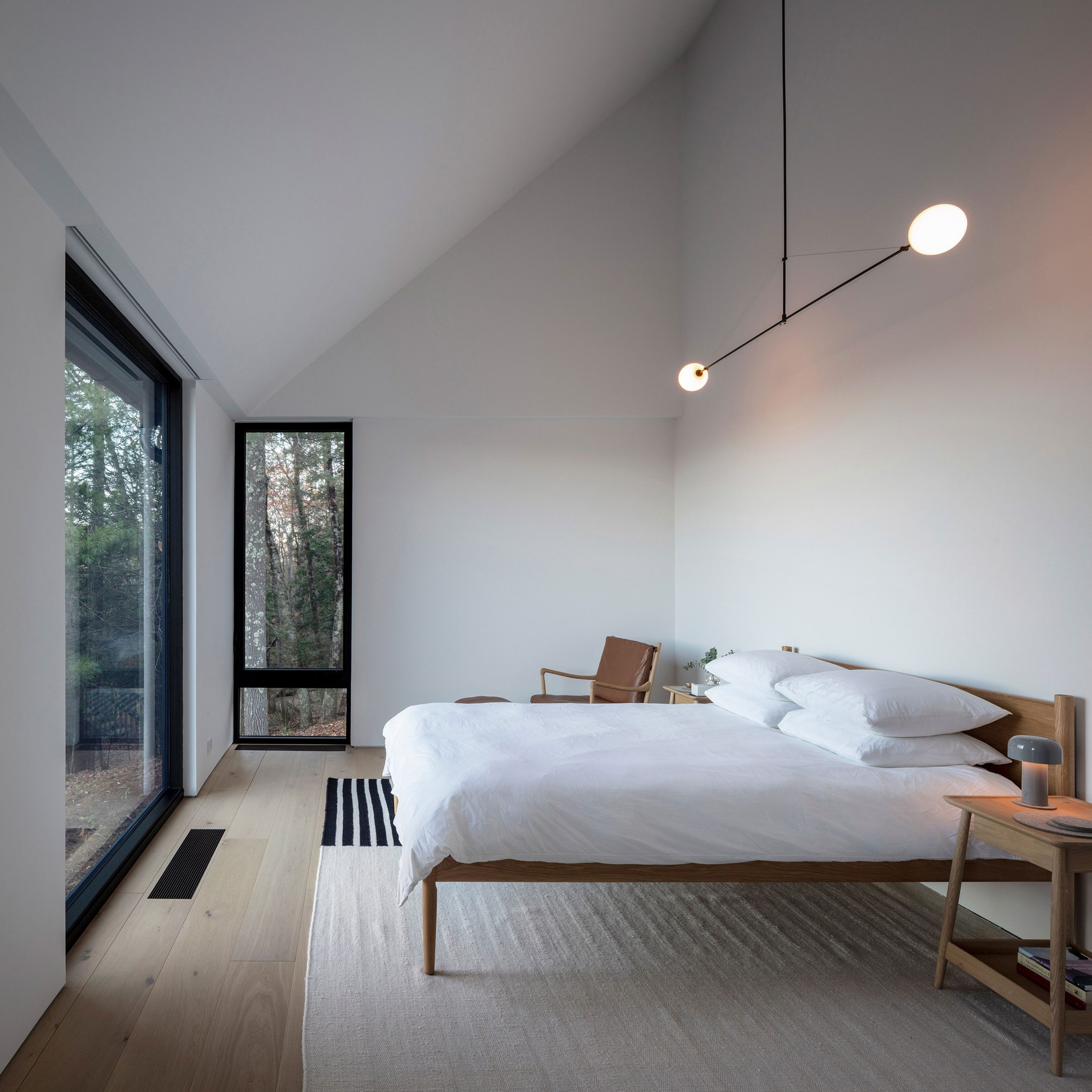 Scandi bedroom with white walls and large windows