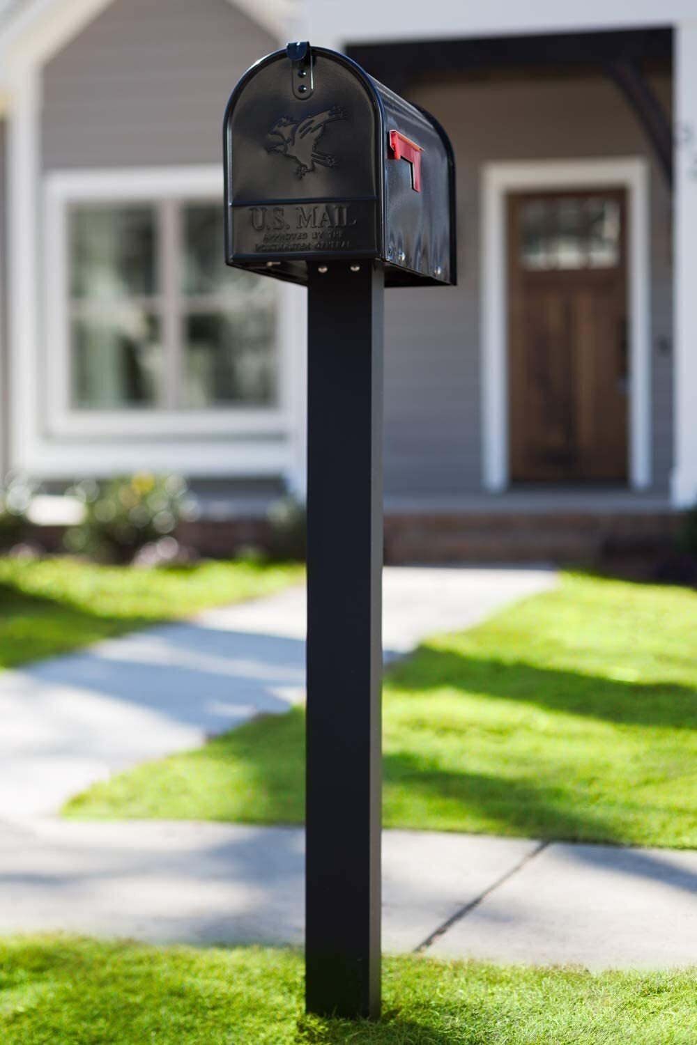 Simple cast iron mailbox post on its own