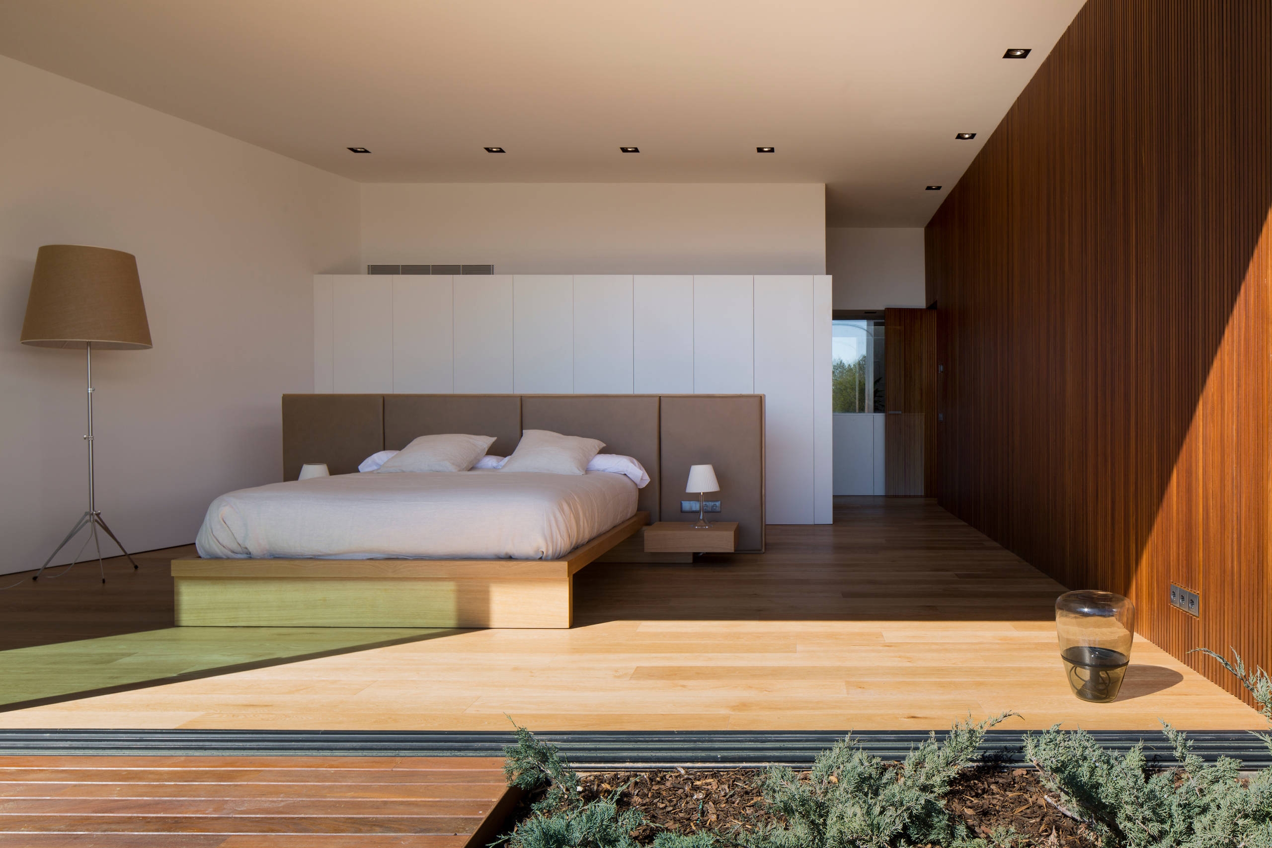 Spacious Japandi bedroom with wooden elements