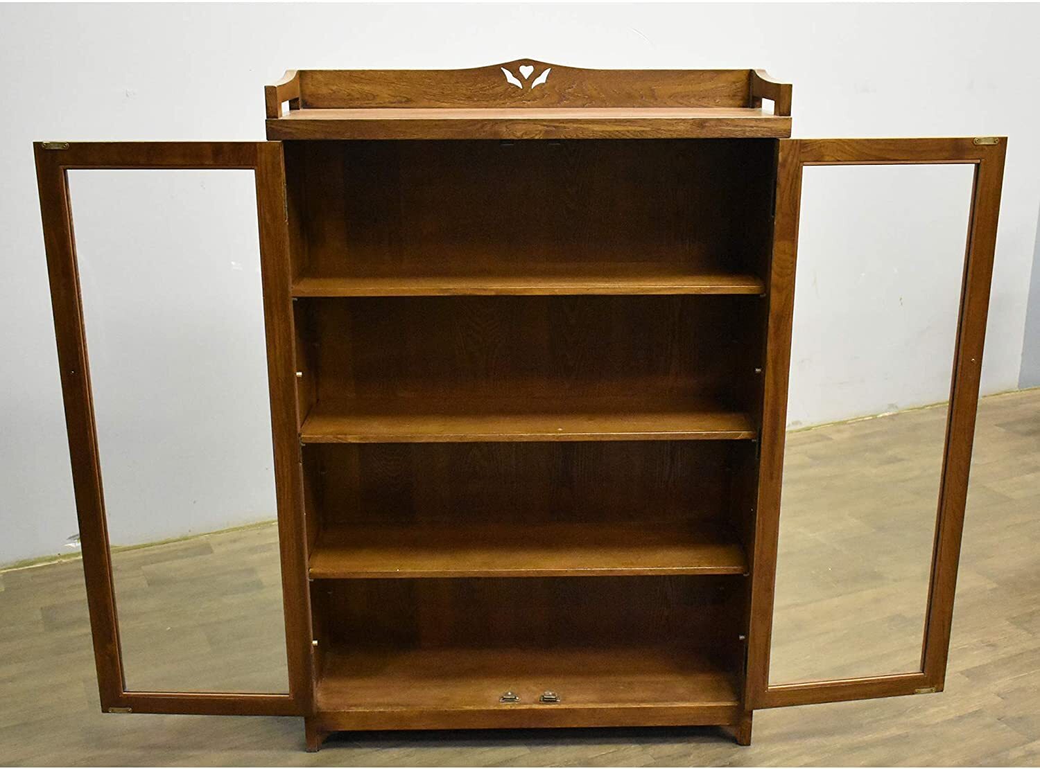 Two door bookcase with cut out detail