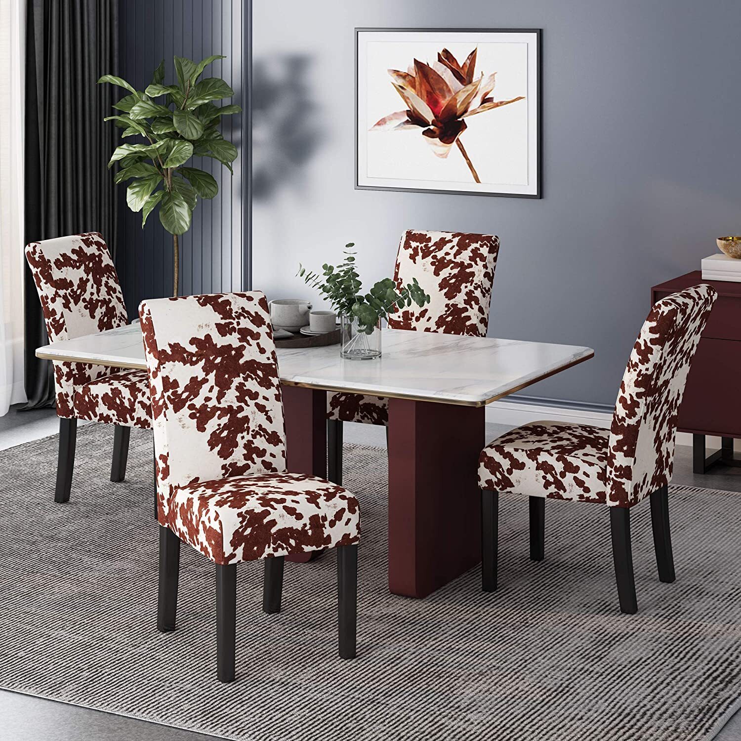Upholstered animal print dining chairs with a high back
