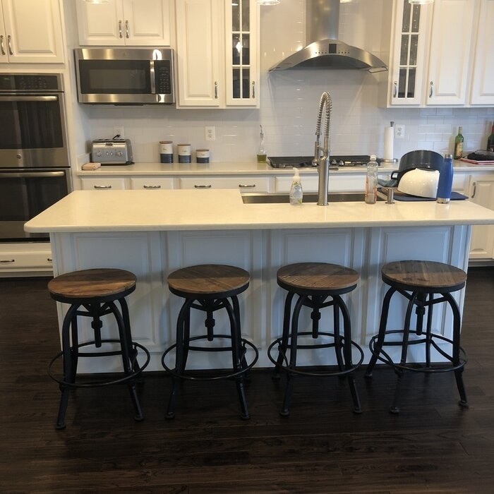 Cothern Swivel Solid Wood Adjustable Height Bar Stool