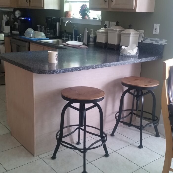 Cothern Swivel Solid Wood Adjustable Height Bar Stool