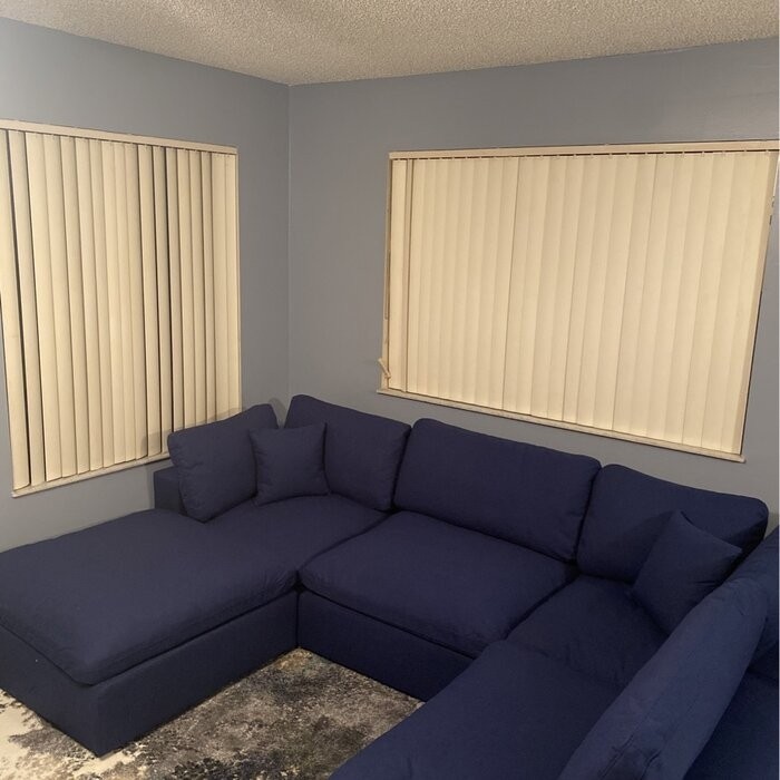 Amillya 119" Wide Reversible Modular Corner Sectional with Ottoman