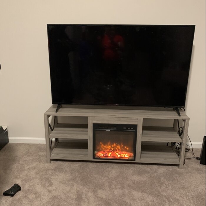 Dajuana TV Stand for TVs up to 65" with Fireplace Included