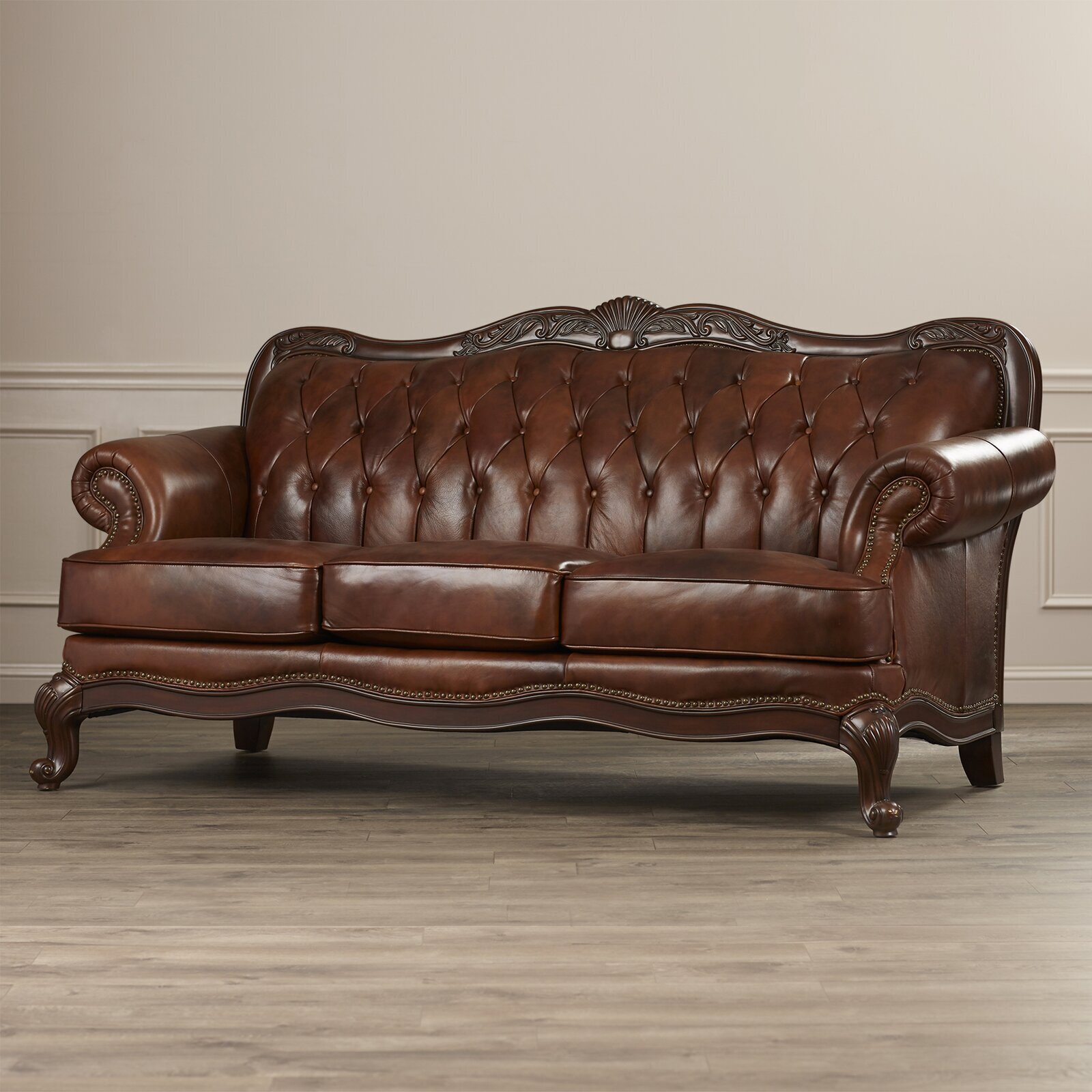 Curvy shaped Leather Sofa With Nailhead Trim