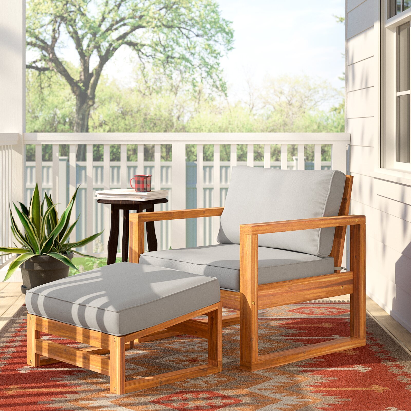 Wooden patio chair with ottoman and cushions