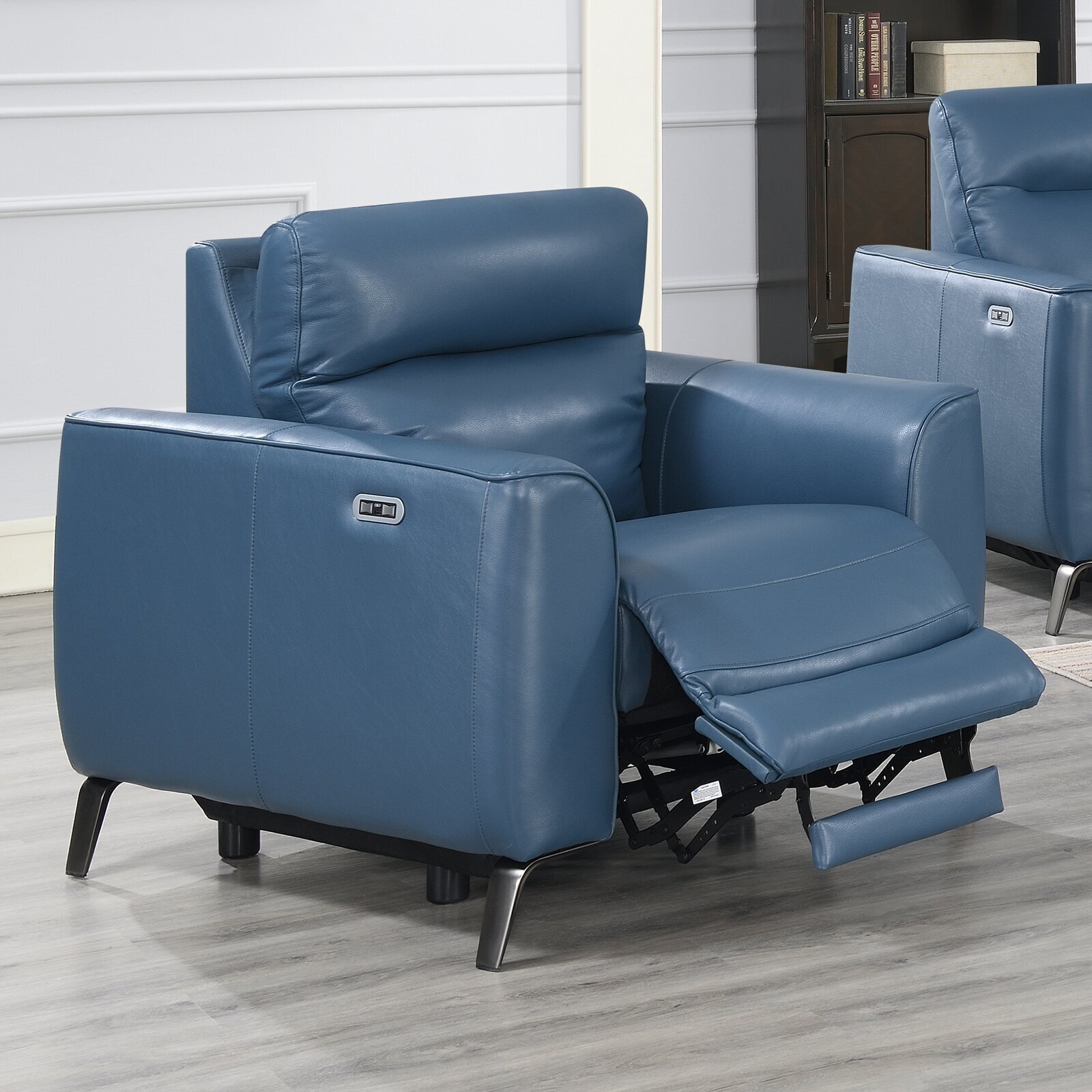 Adjustable blue leather chair with additional features