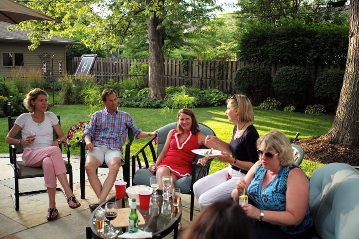 chilling and drinking on the garden furniture outdoors with family chilling and drinking on the garden furniture outdoors with family