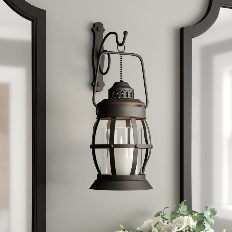 Hanging lantern style wall sconce