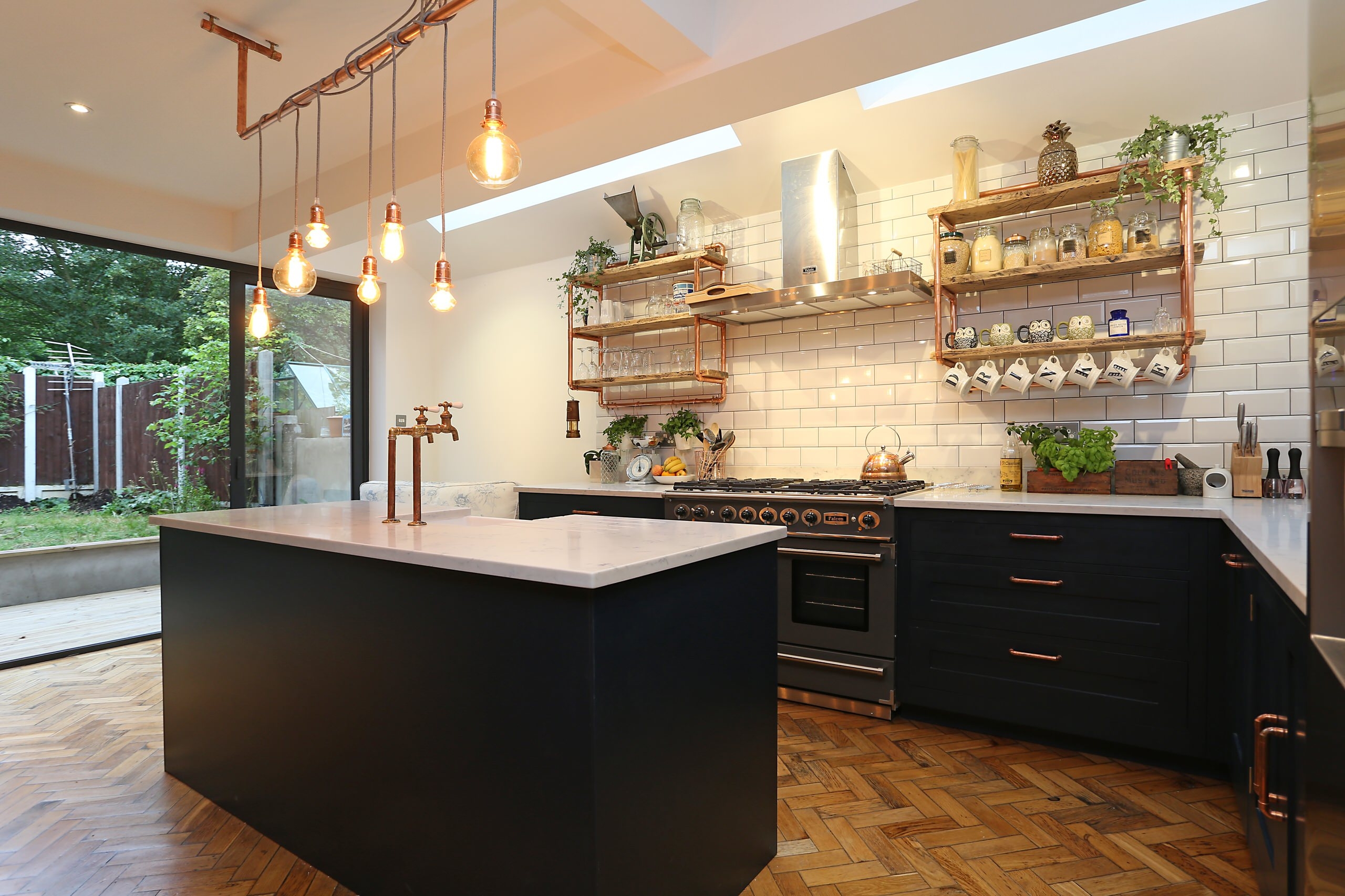 Industrial kitchen with a white backsplash