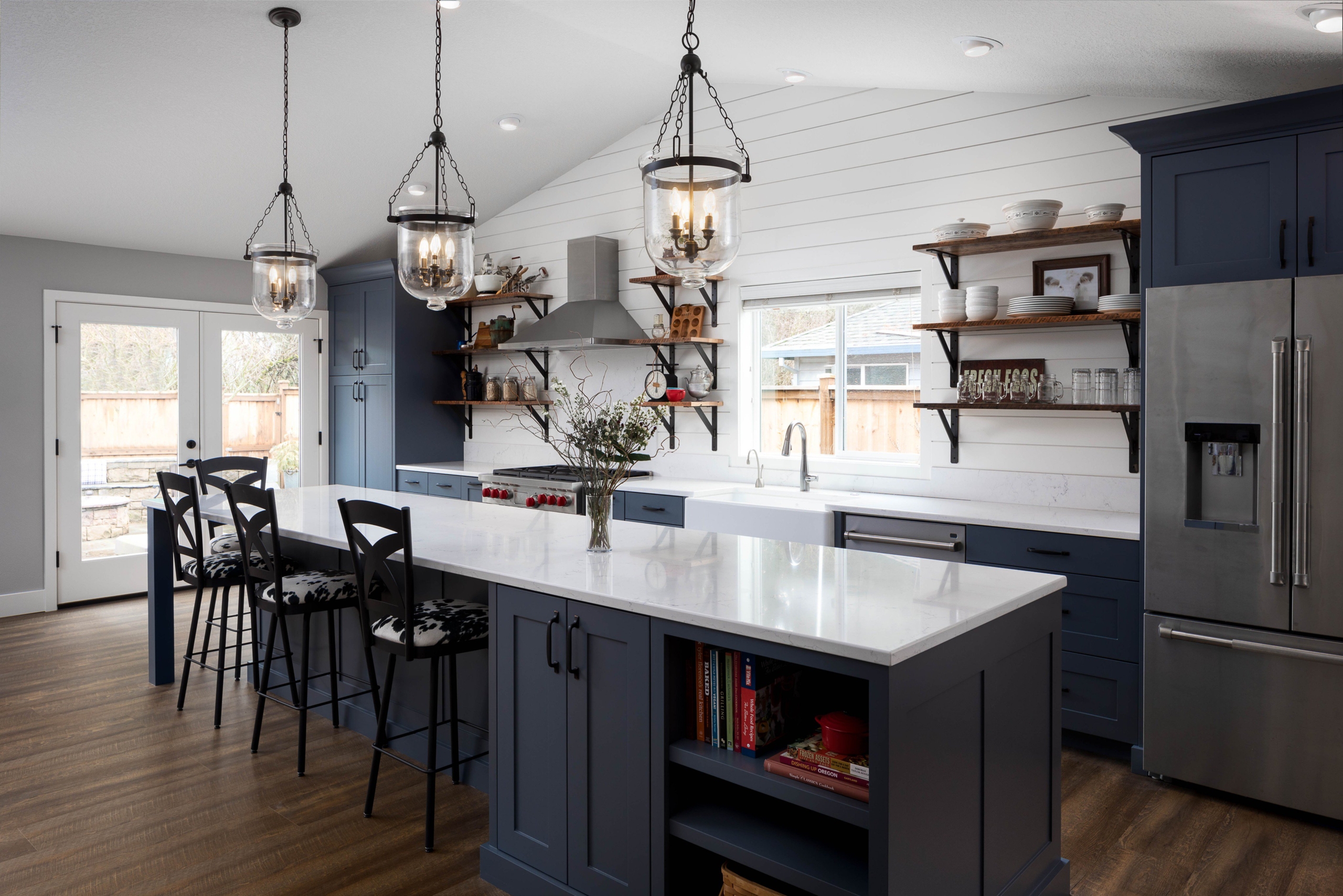 Kitchen With Shiny Countertops And Refrigerator
