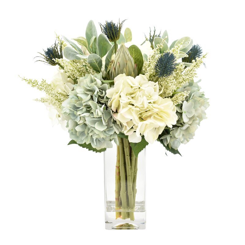Lifelike flower arrangements in a vase 