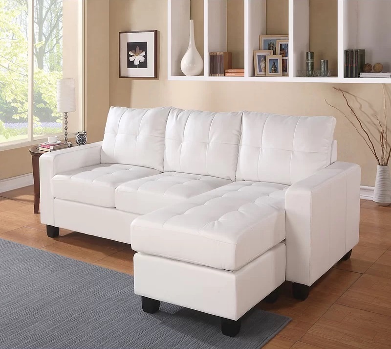 Quaint Faux Leather Right Hand Facing Sofa and Chaise With Ottoman