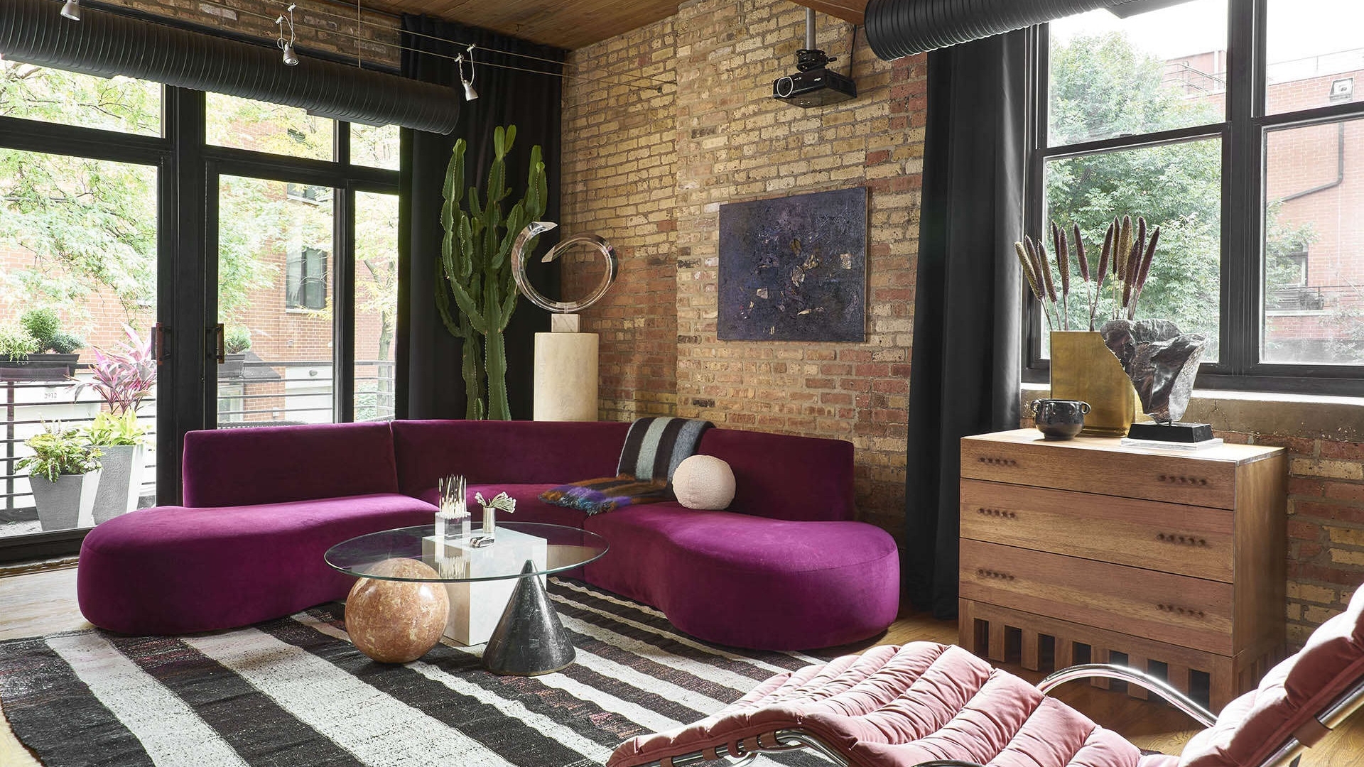 Room With Bright Fuchsia Colored Sofa