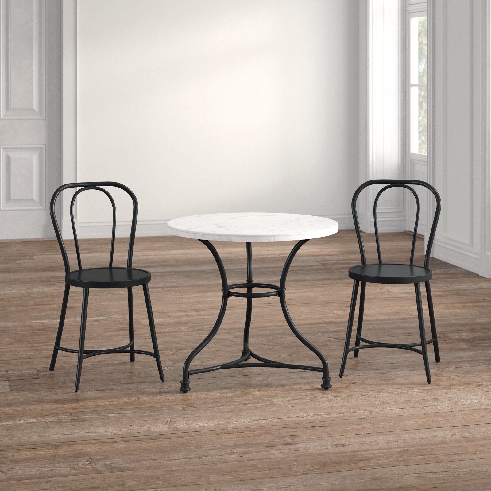 Round marble table and chairs with French flair