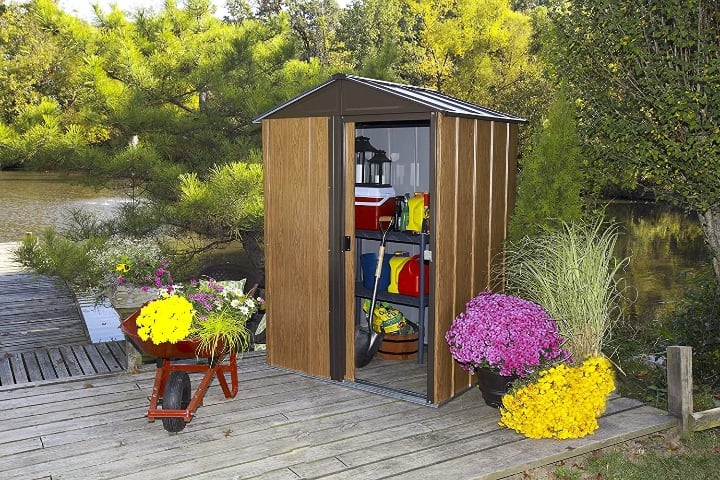 small garden shed with tools inside