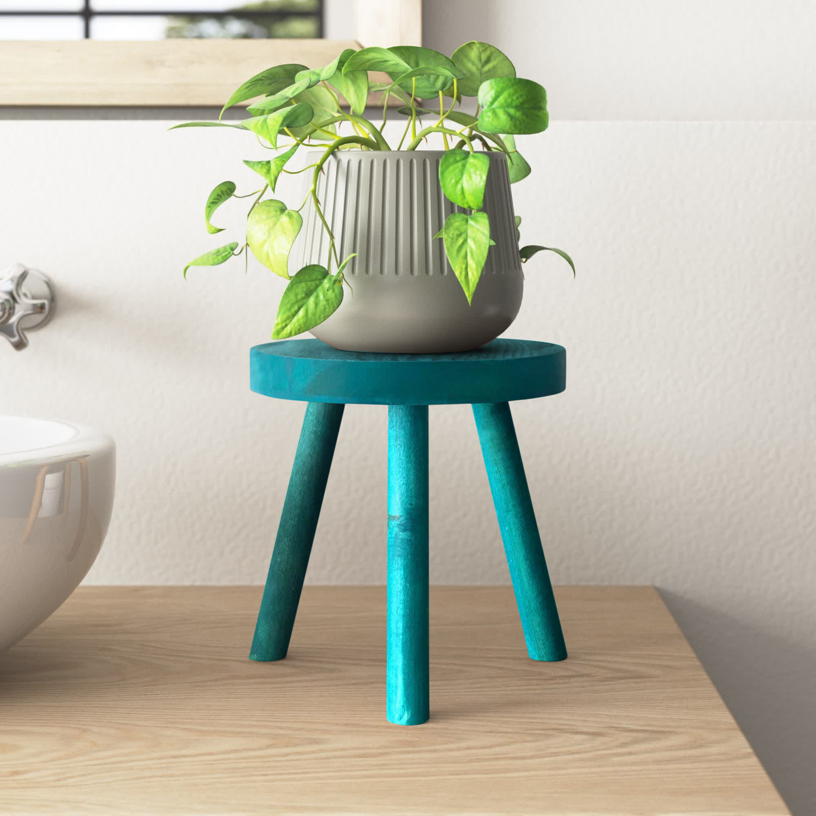 Vibrant, retro plant stand with flared legs