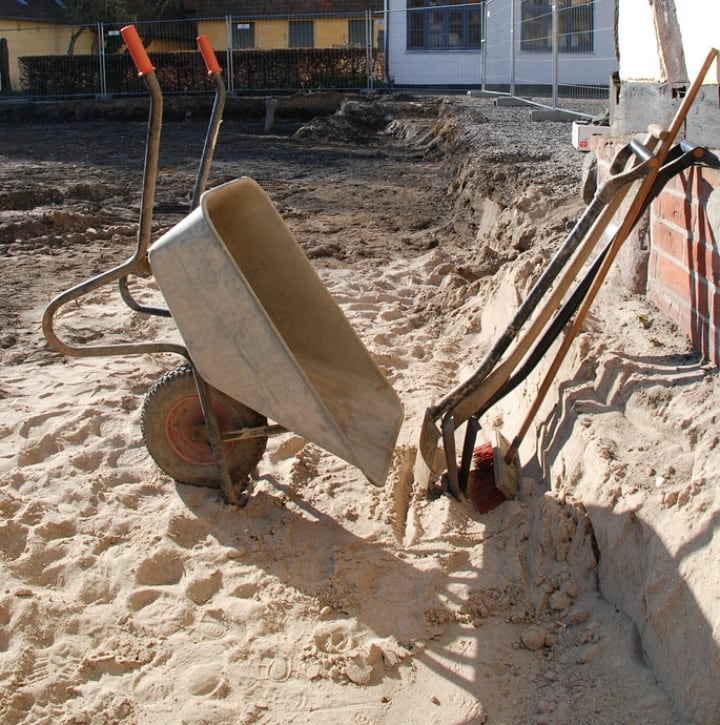wheelbarrow shovel and trowels in the garden wheelbarrow shovel and trowels in the garden