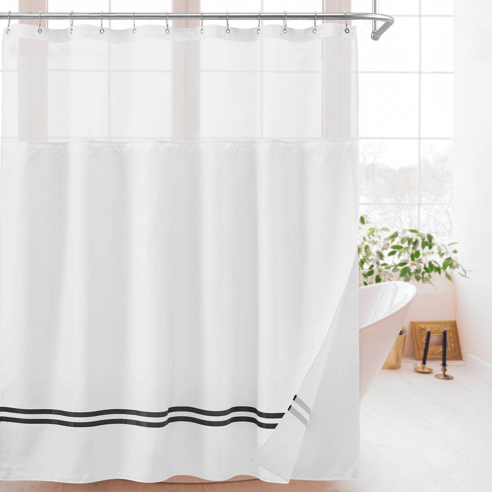 White shower curtain with black stripes