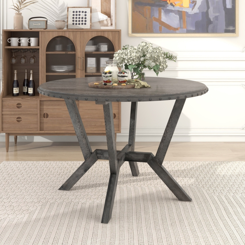 Round Dining Table with Bronze Nailhead Accents