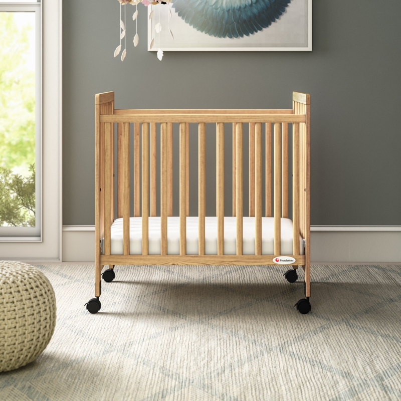 Compact Wooden Crib with Lockable Casters