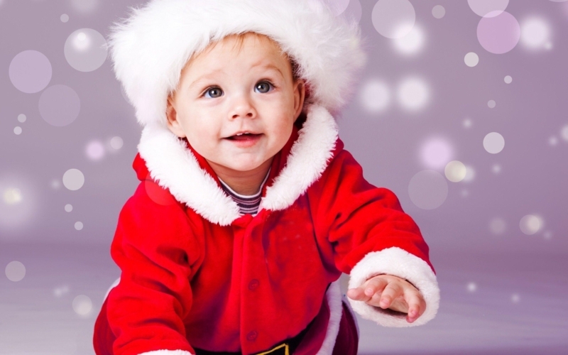 Adorable Baby Boy in Festive Santa Outfit Wallpaper