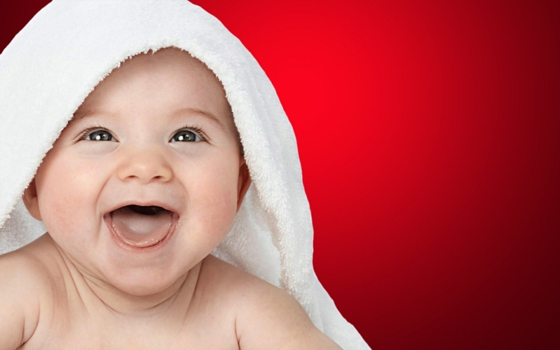 Adorable Smiling Baby Boy with White Towel