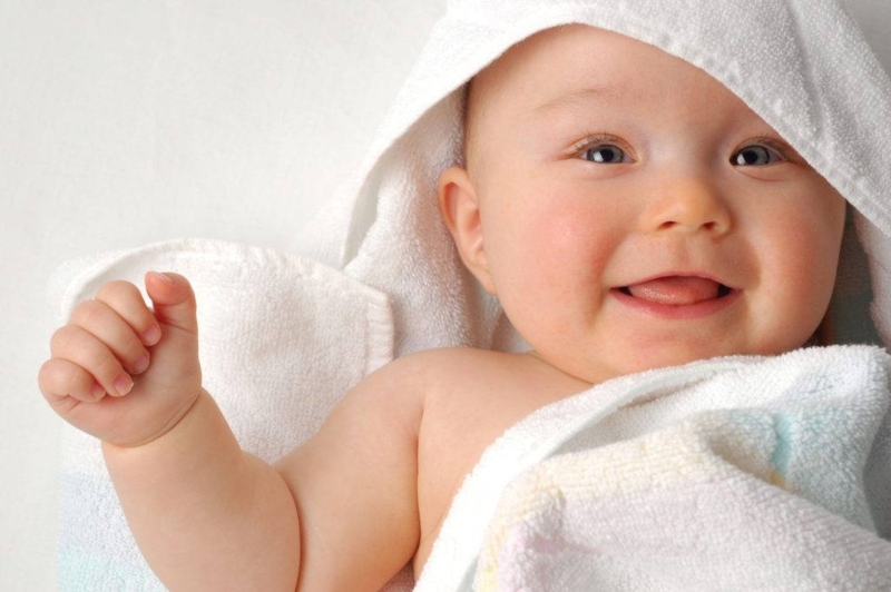 Cute Smiling Baby Boy Wrapped in Towel