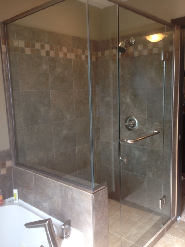 Elegant Half Wall Glass Shower with Neutral Tiles