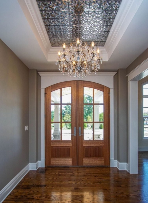Crystal Chandelier with Ornate Tin Ceiling Entryway
