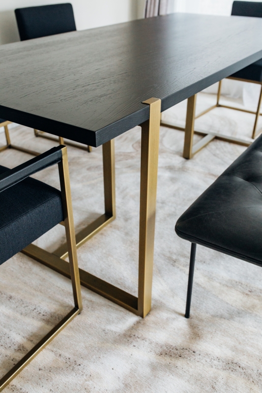 Modern Black Dining Table with Elegant Gold Base