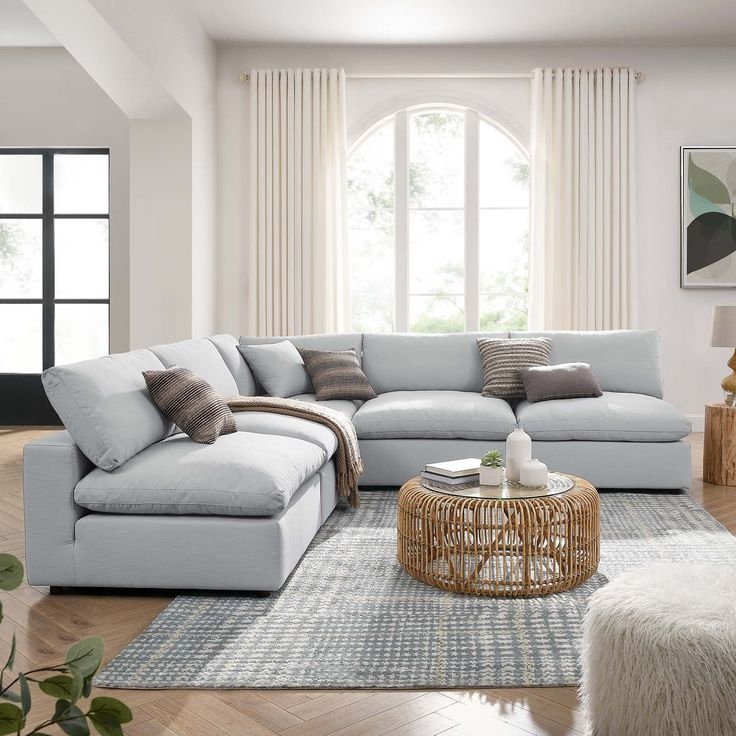 Light Blue Overstuffed Sectional Sofa with Rattan Coffee Table