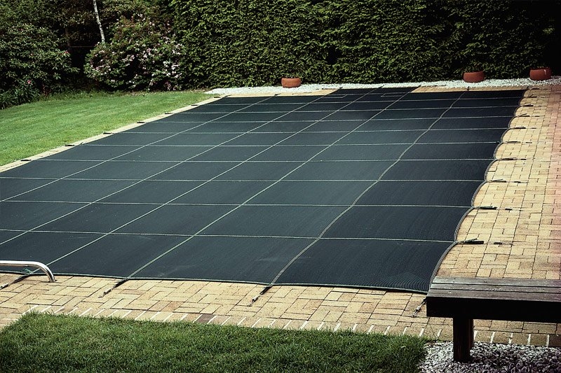 Durable Safety Pool Cover in Modern Backyard