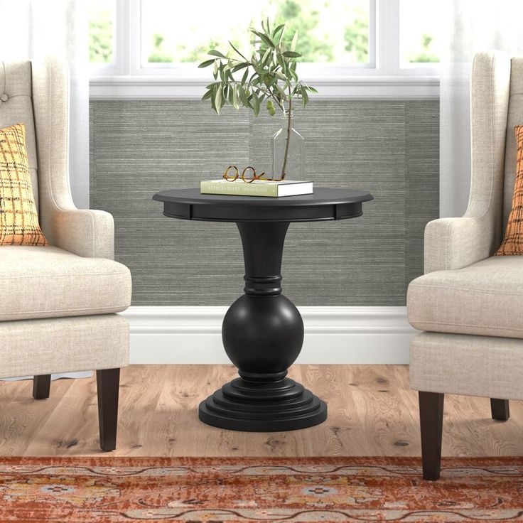 Black Round Pedestal End Table in Living Room