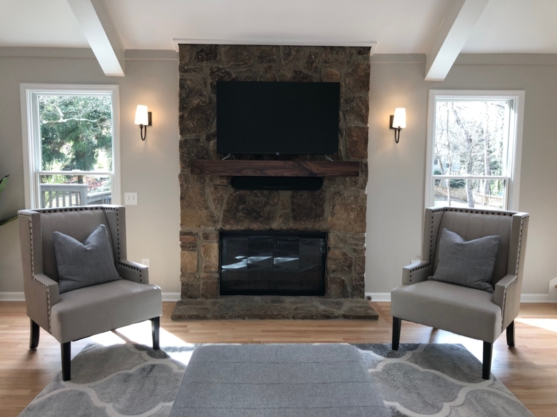 Cozy Living Room with Stone Fireplace and Walnut Mantel