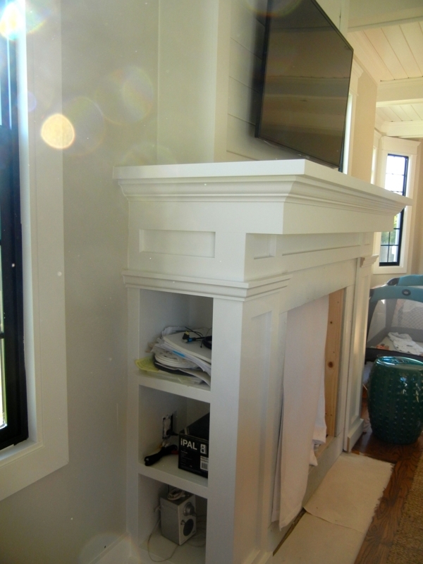 White Fireplace Mantel with Built-in Storage Shelves