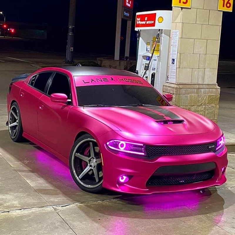 Vibrant Pink Dodge Charger with Neon Accent Lighting