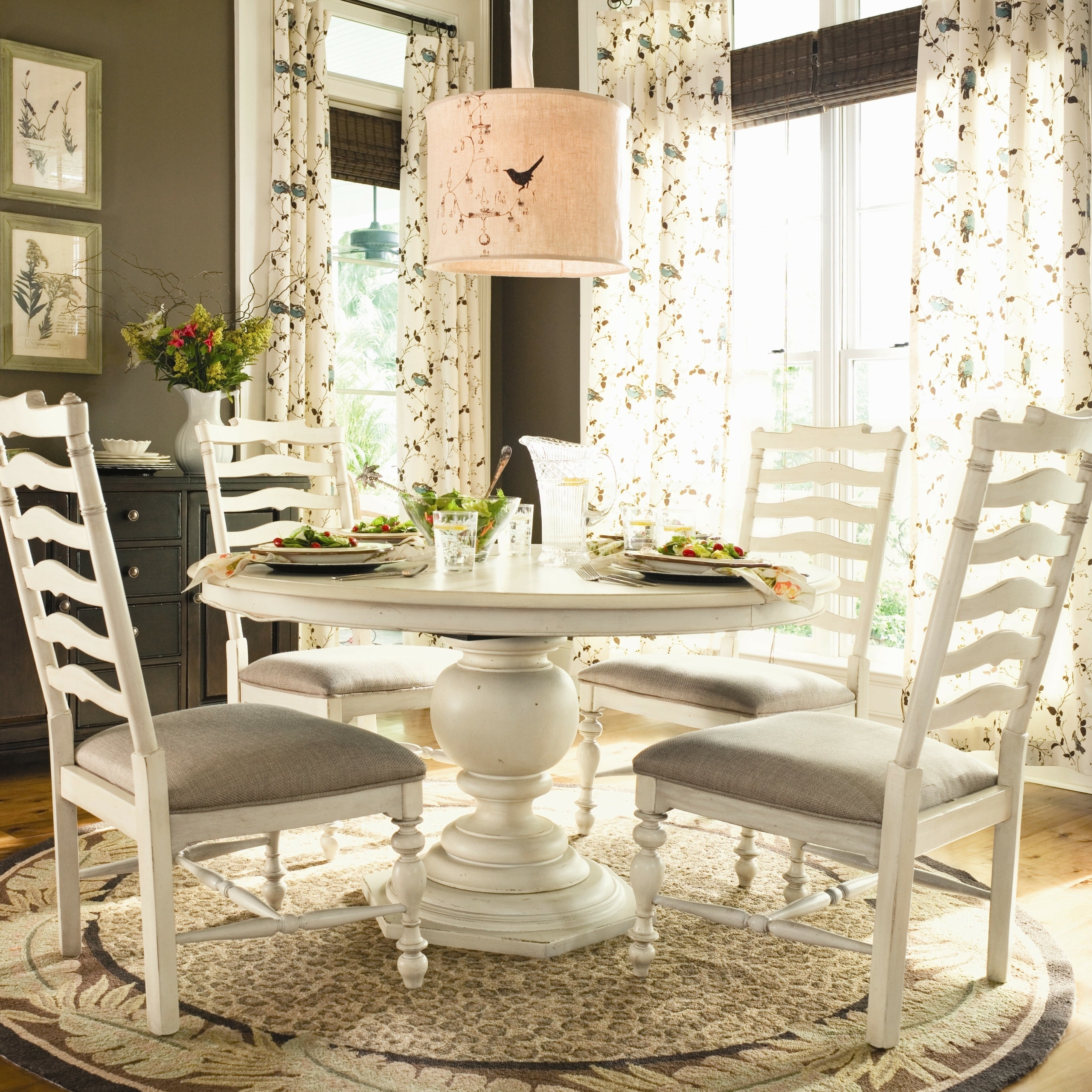 white pedestal dining table and chairs