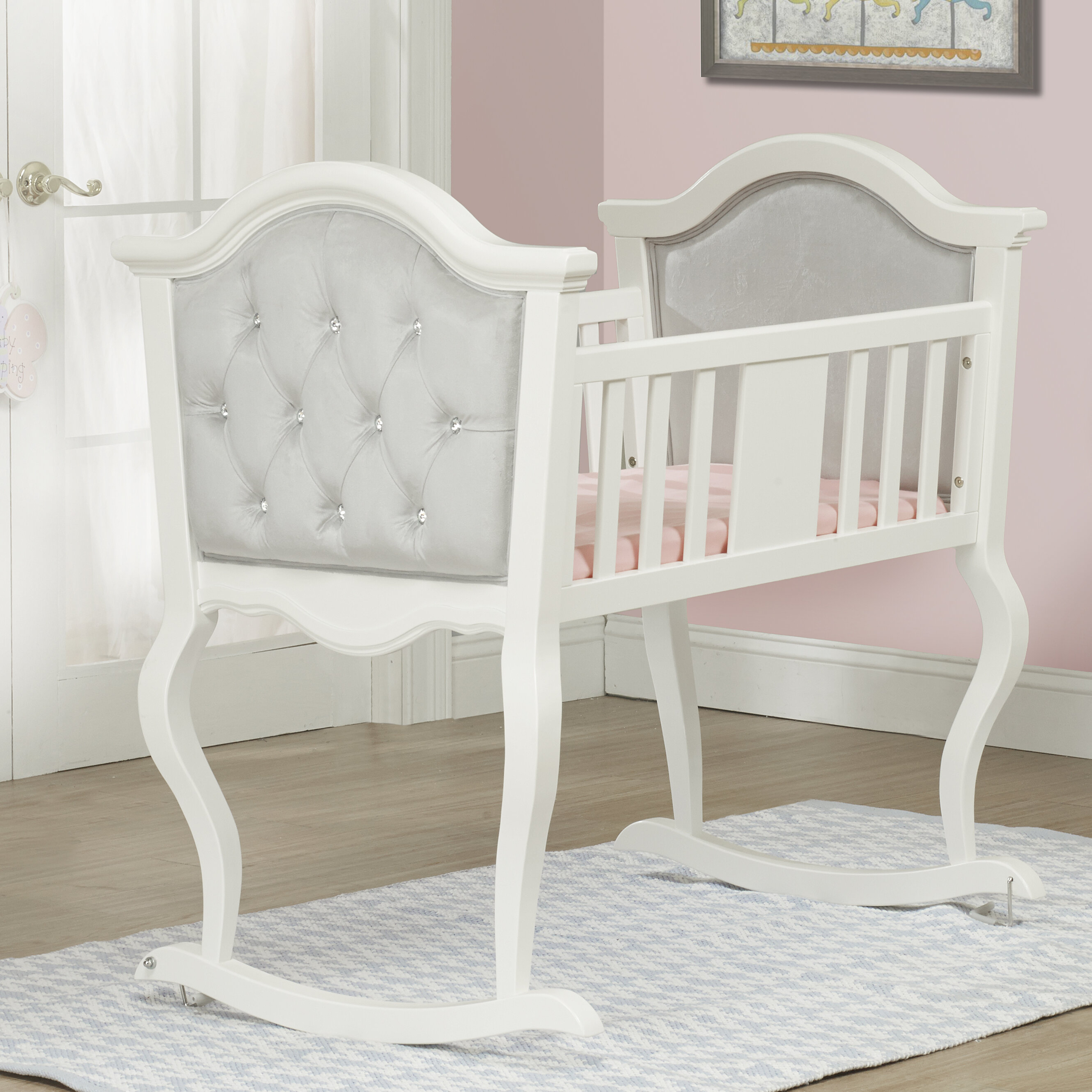 white wooden bassinet